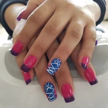Bright pink manicure with blue patterned accent nails
