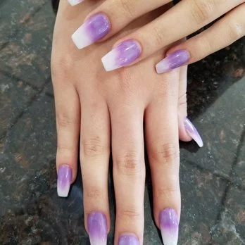 Lavender nails with pale marble-style accent details