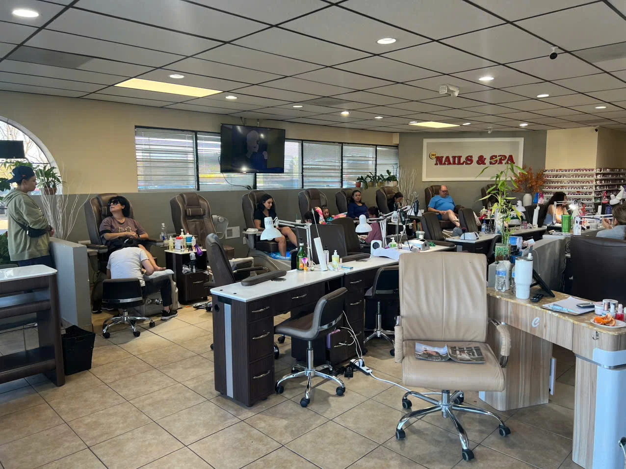 Pedicure chairs and treatment stations at 360 Nails & Spa in Northglenn