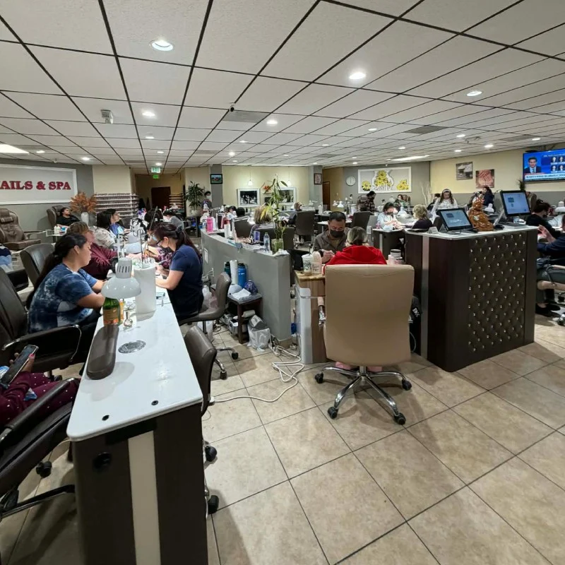 Comfortable seating and treatment stations inside 360 Nails & Spa